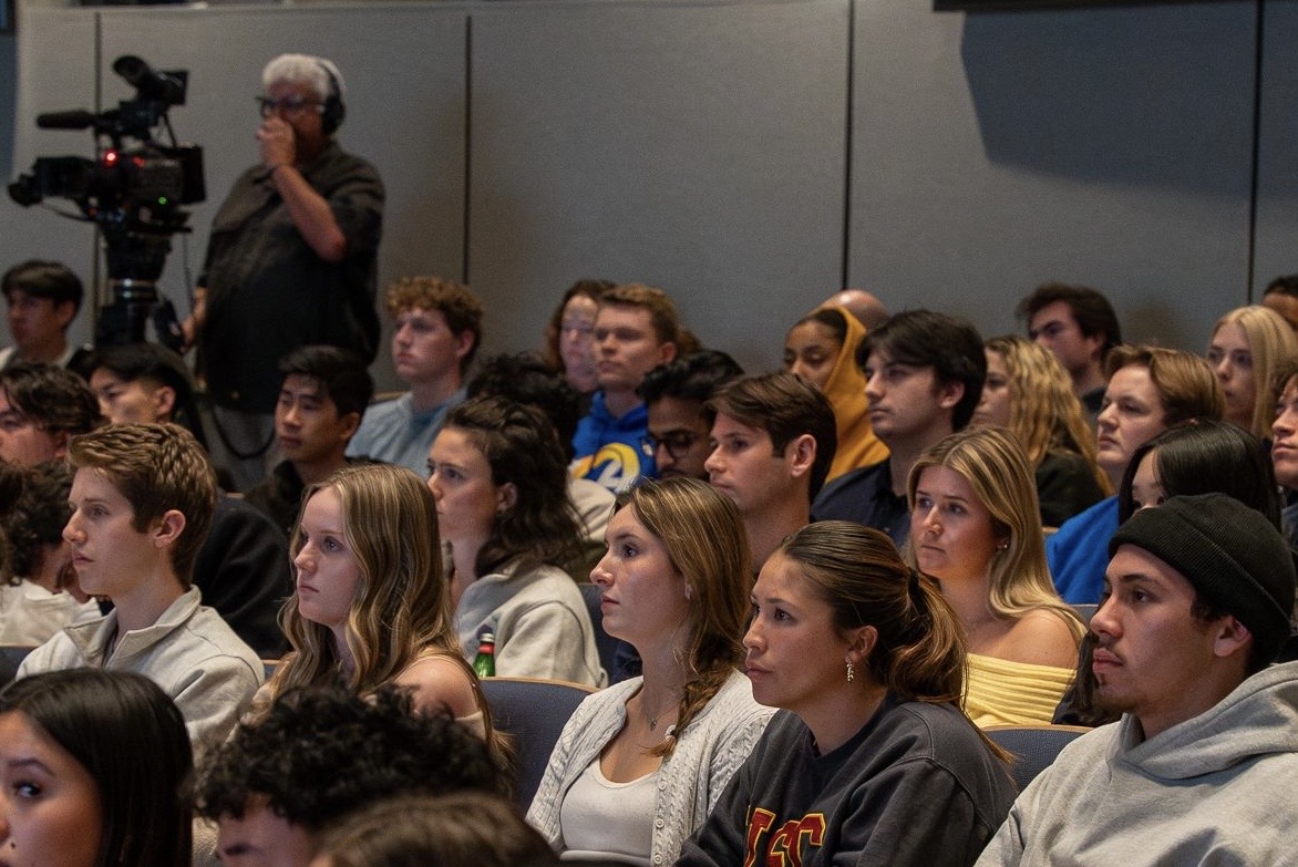 Another audience shot showing the full room of students at the Game is Life lecture
